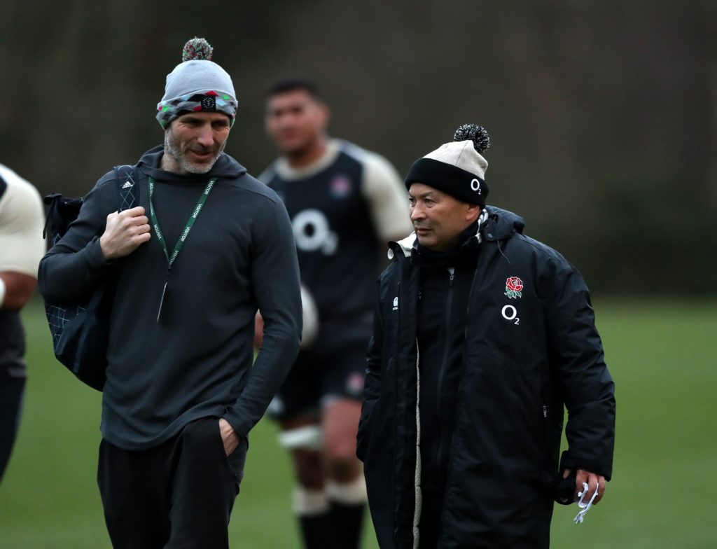 Paul Gustard and Eddie Jones converse at England training