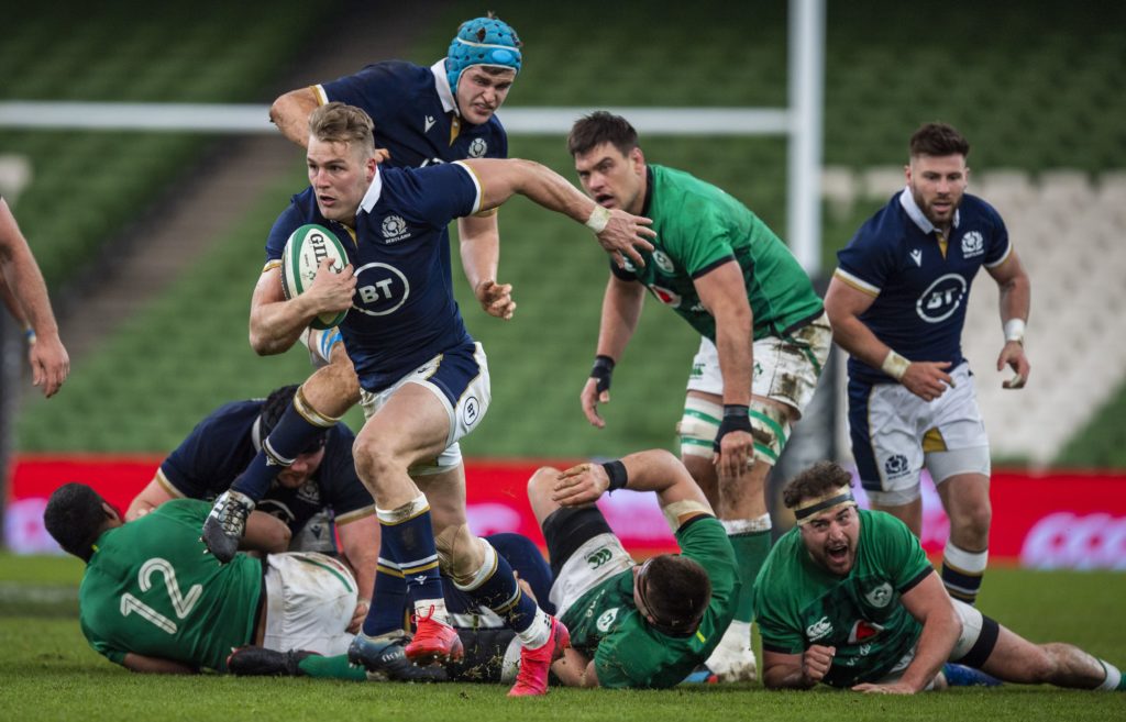 Duhan van der Merwe streaks away from the Irish defenders to score a try for Scotland