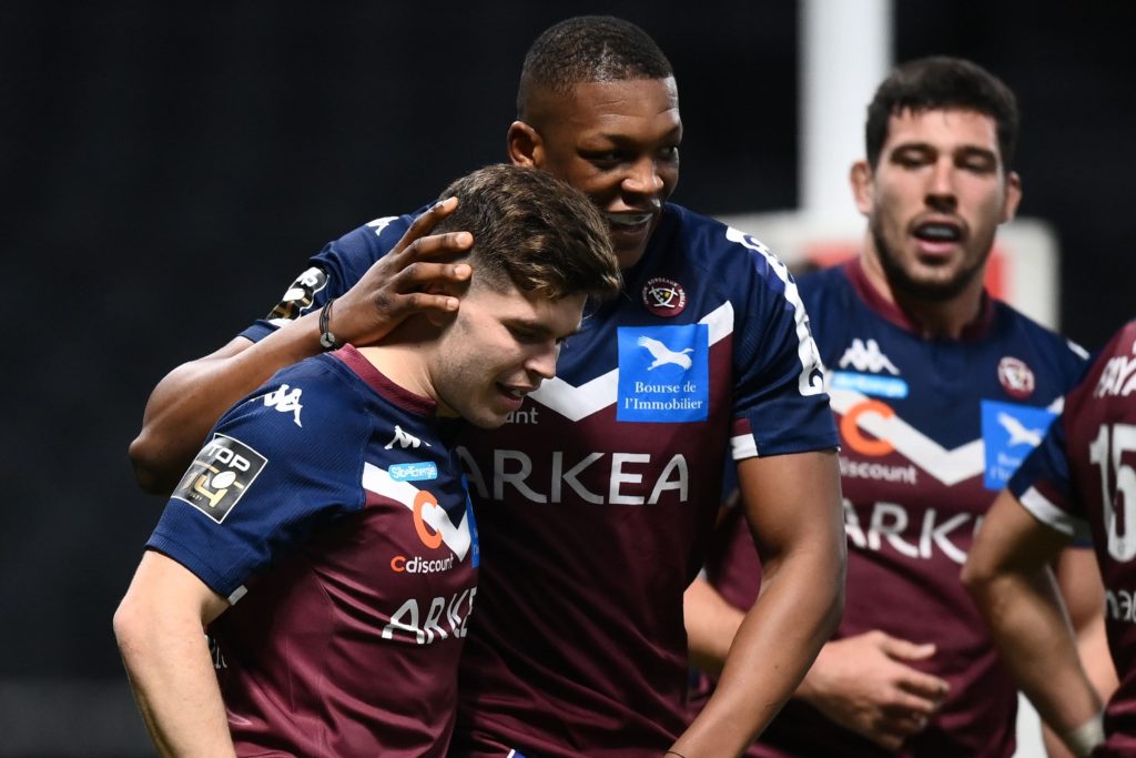 Matthieu Jalibert is congratulated by team-mates after scoring a try for Bordeaux-Begles.