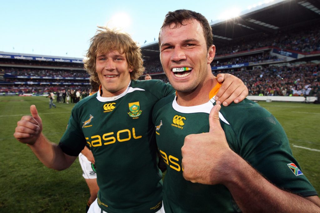 Frans Steyn and Bismarck du Plessis celebrate beating the British and Irish Lions for South Africa.