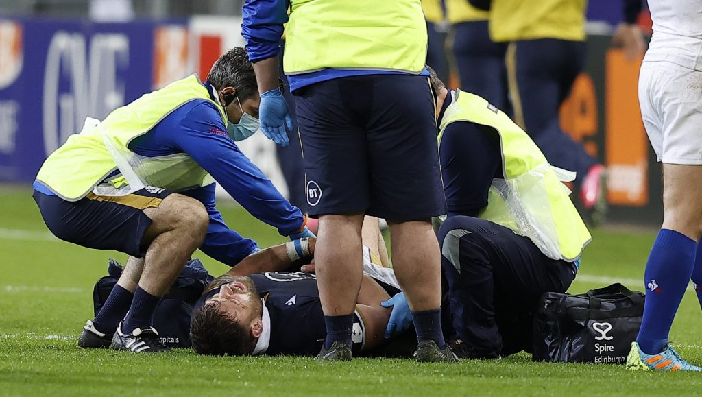 Rory Sutherland receives treatment during Scotland's match with France