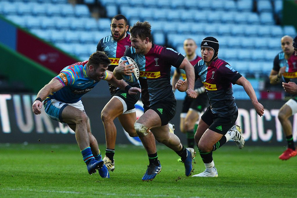 Will Evans makes a break for Harlequins against Leicester Tigers