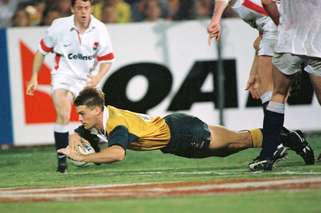 Ben Tune of Australia scores a try against England